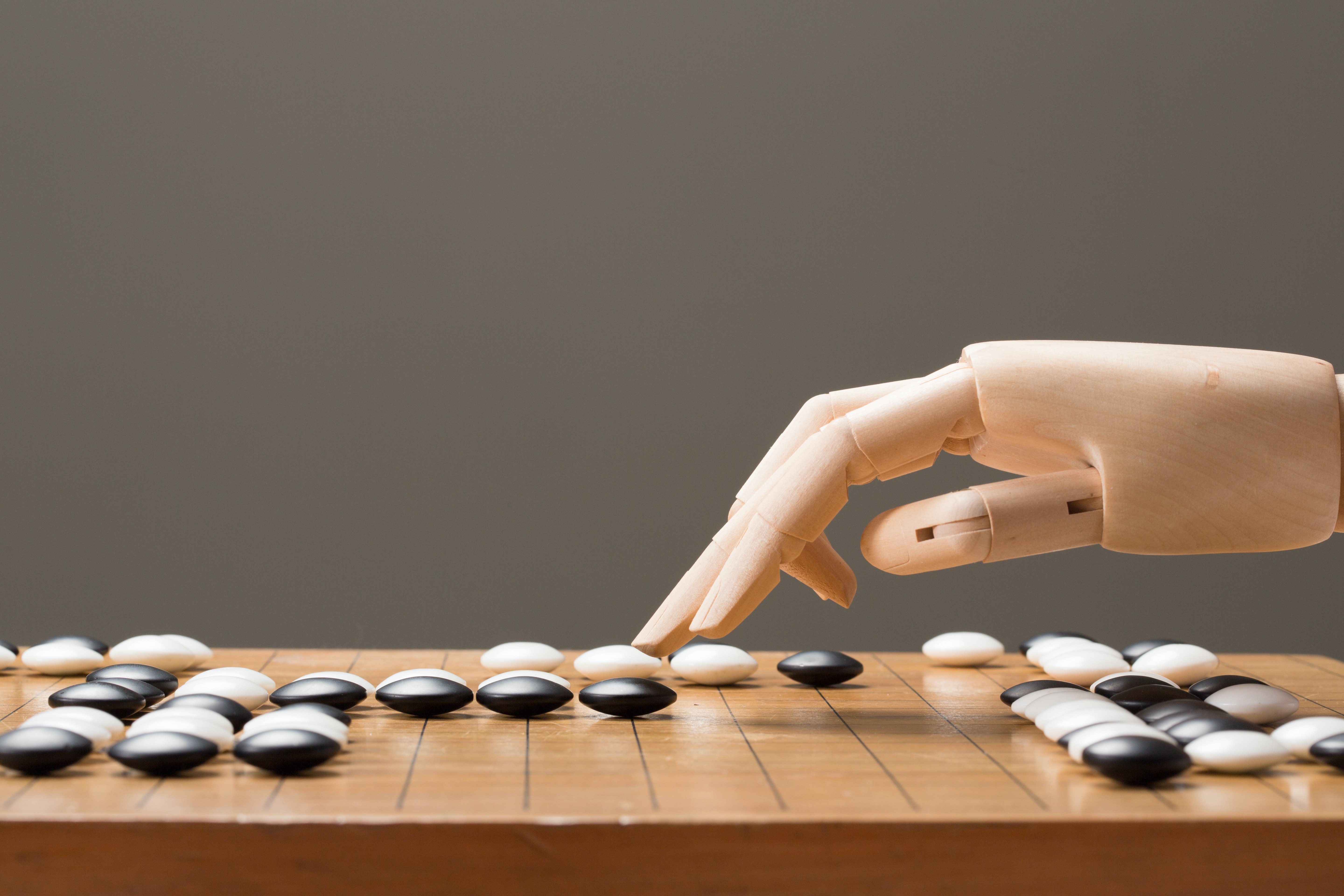 A robot hand playing the ancient Chinese boardgame called Go