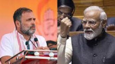 Rahul Gandhi at a public meeting questioning Prime Minister Narendra Modi